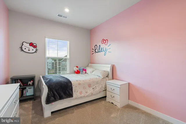 a view of a bedroom from a hallway