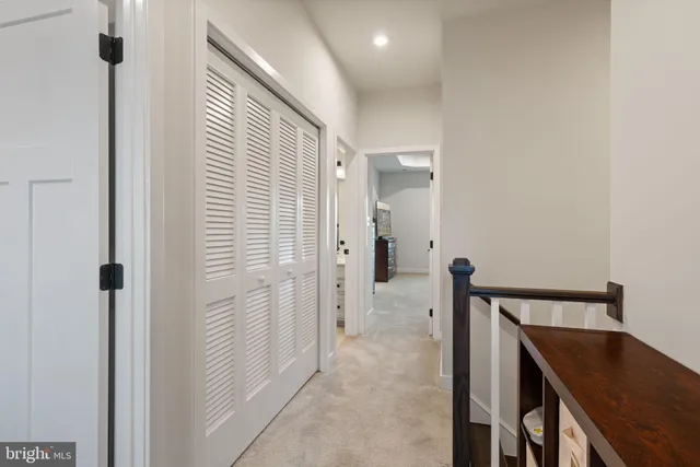 a kitchen with stainless steel appliances granite countertop a stove a microwave and a white cabinets