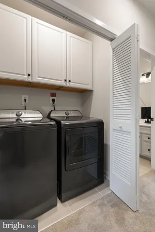 a white toilet sitting next to a bath tub