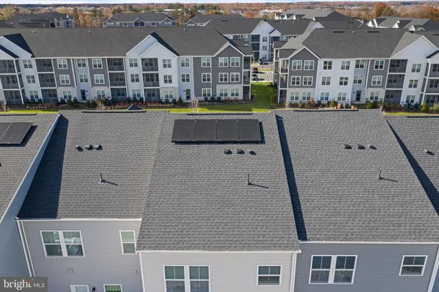 a picture of a bench in front of a wall