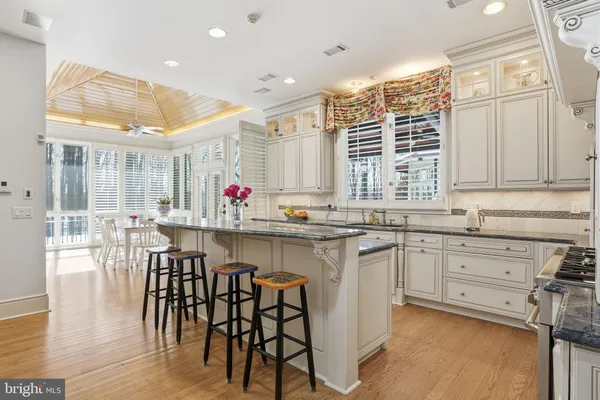 a living room with furniture a flat screen tv and a window