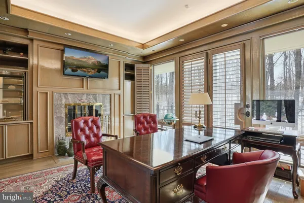 a view of a livingroom with walk in closet and bathroom