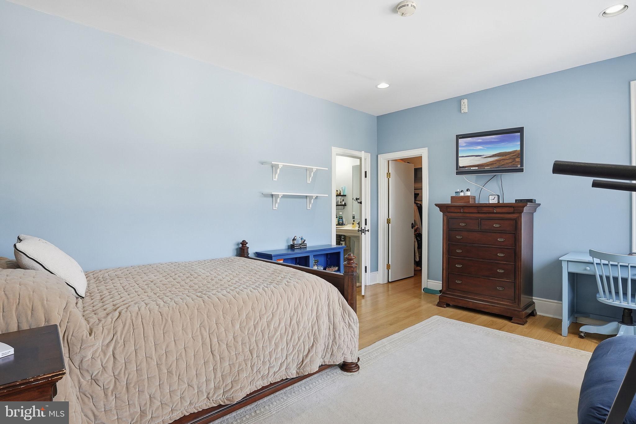 11940 River Road Potomac, MD 20854 - Photo 42 of 75 a bed room with a bed and a television
