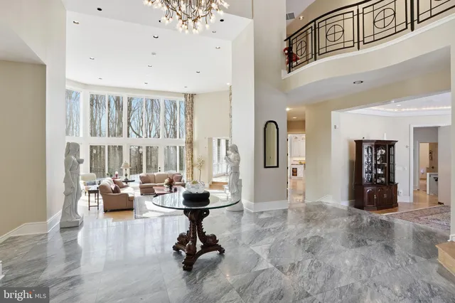 a view of entryway and hallway with a front door