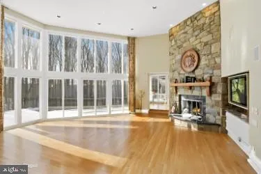 a living room with fireplace furniture and a flat screen tv