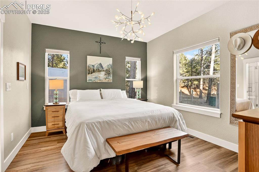 9920 Hodgen Road Colorado Springs, CO 80908 - Photo 16 of 49 a bedroom with a bed and a window