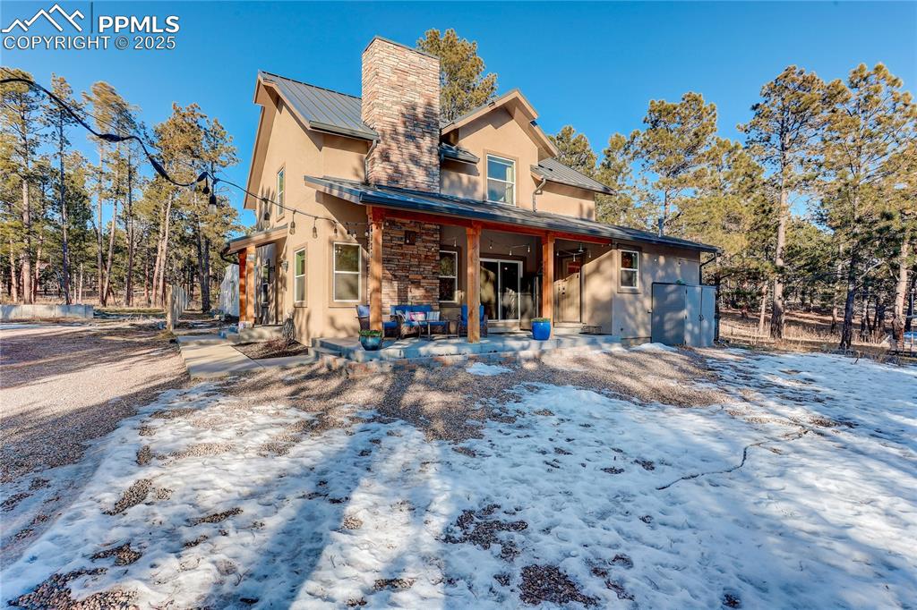 9920 Hodgen Road Colorado Springs, CO 80908 - Photo 2 of 49 a view of a town with large trees and plants