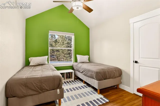 a view of room with furniture and wooden floor