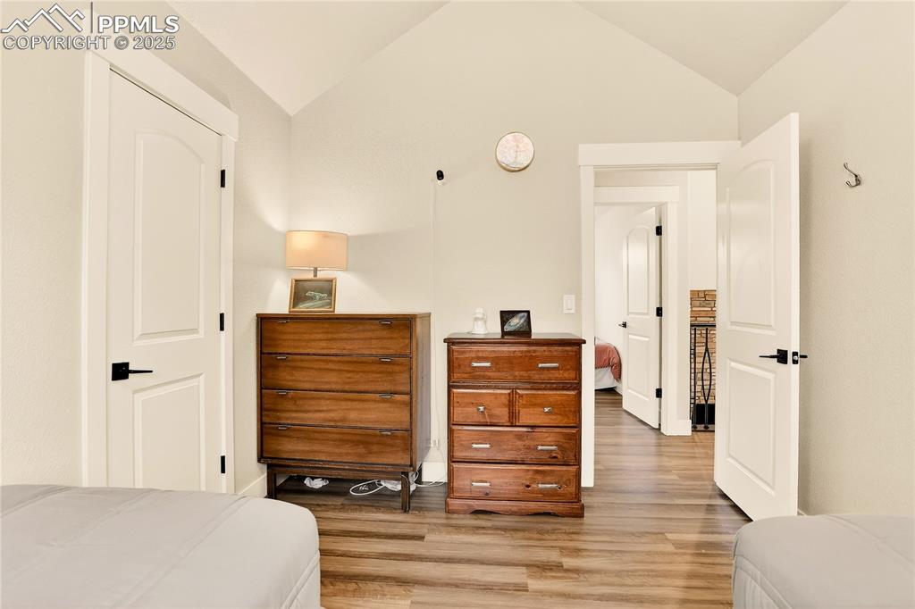 9920 Hodgen Road Colorado Springs, CO 80908 - Photo 23 of 49 a view of room with furniture and wooden floor