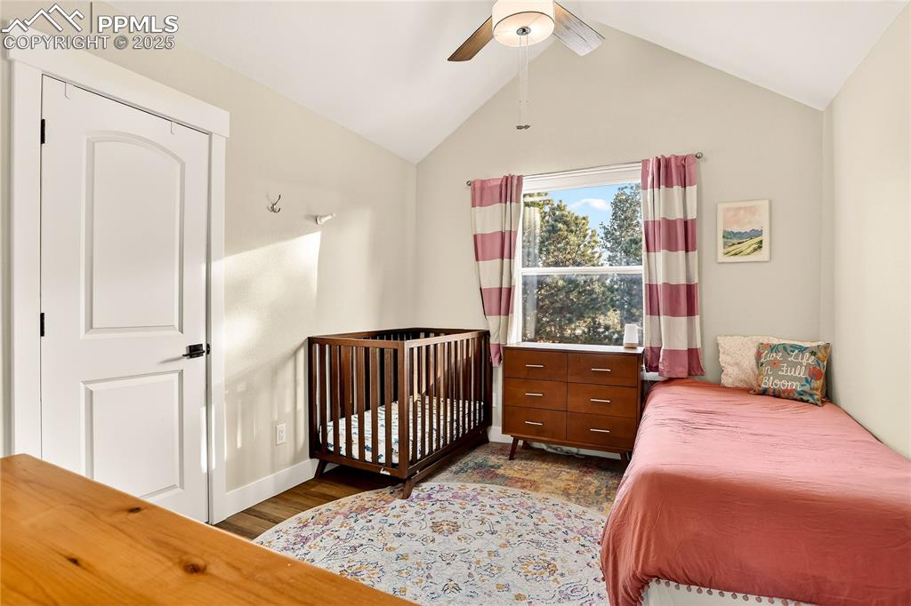 9920 Hodgen Road Colorado Springs, CO 80908 - Photo 24 of 49 a bedroom with a bed and a window
