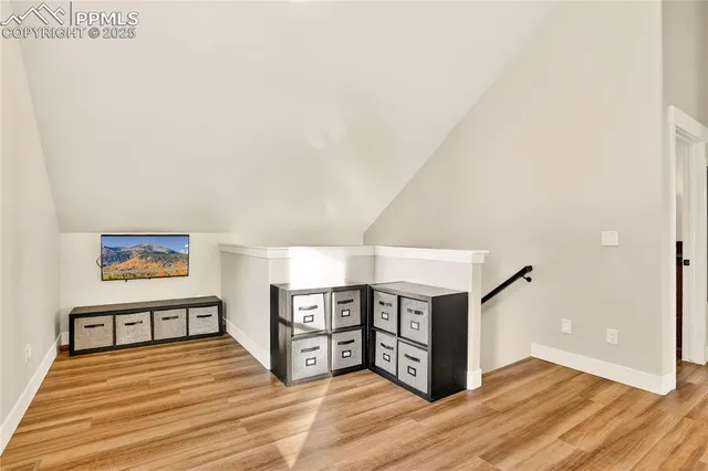 a view of a balcony with wooden floor