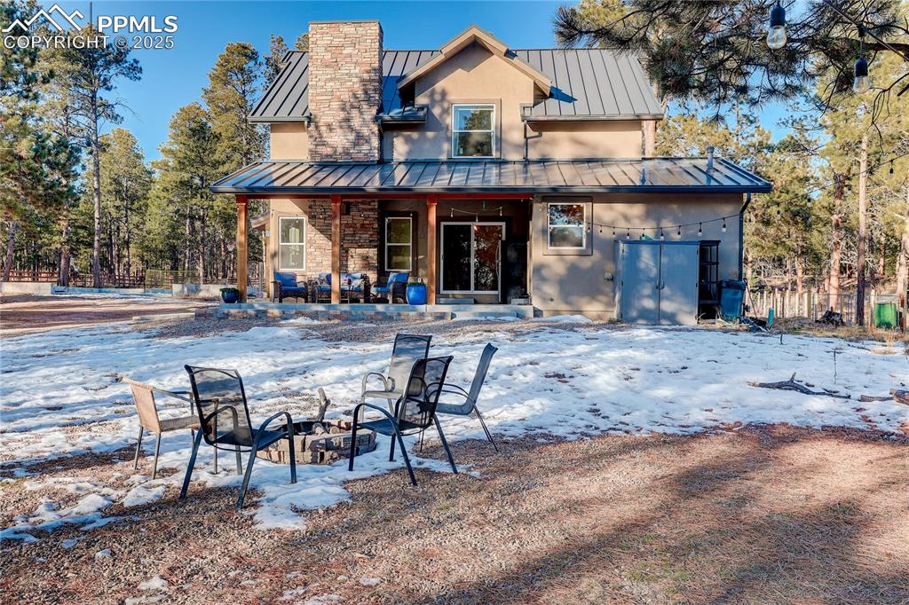 9920 Hodgen Road Colorado Springs, CO 80908 - Photo 31 of 49 a view of a cafe with table and chairs in front of it