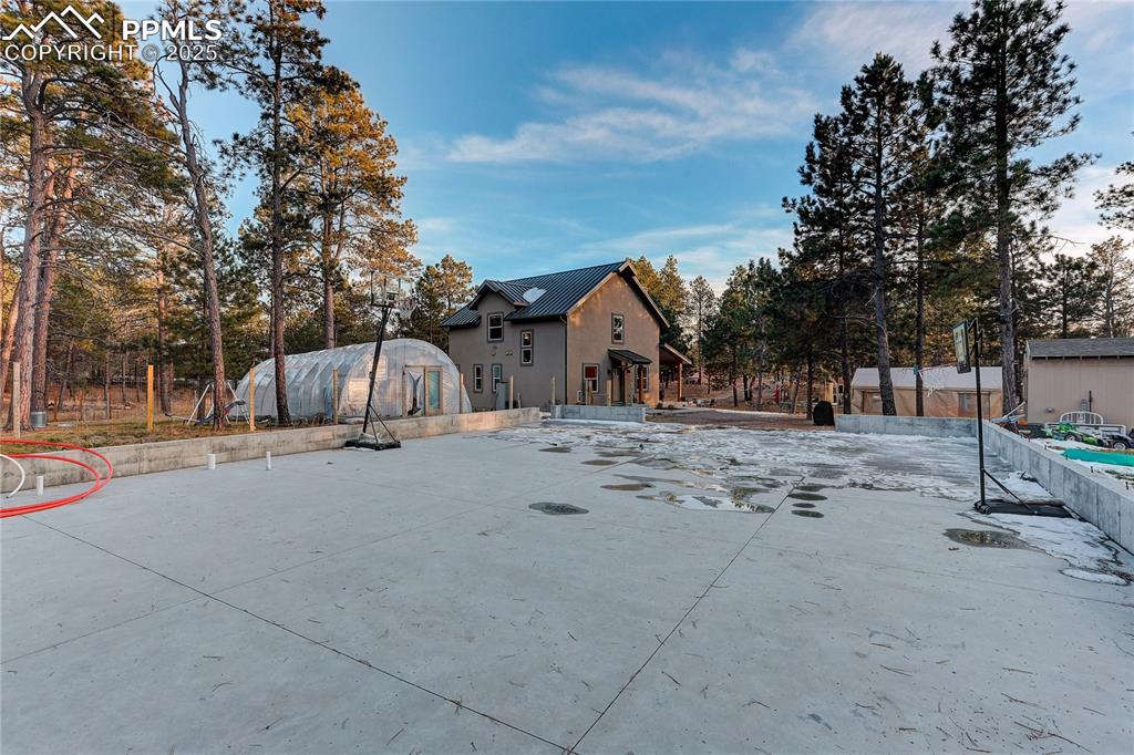 9920 Hodgen Road Colorado Springs, CO 80908 - Photo 37 of 49 a view of street with large trees