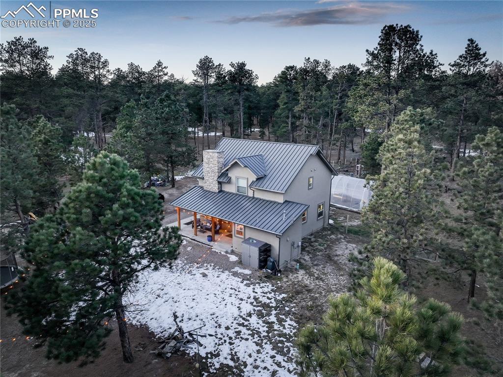9920 Hodgen Road Colorado Springs, CO 80908 - Photo 42 of 49 a view of a house with a yard and tree s