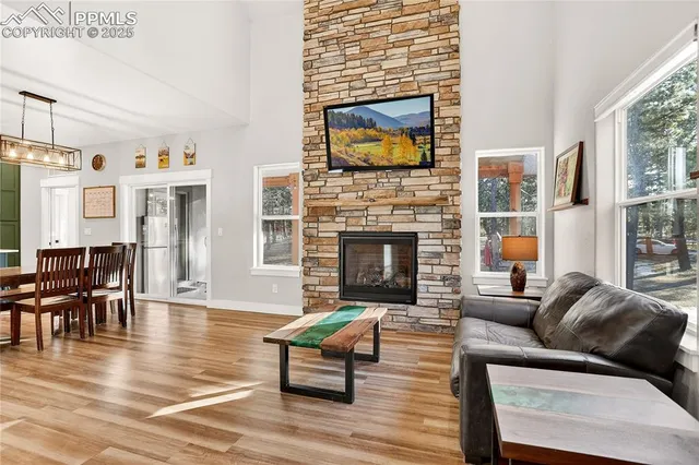 a living room with furniture fireplace and flat screen tv