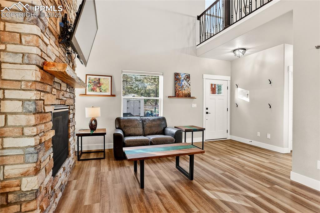 9920 Hodgen Road Colorado Springs, CO 80908 - Photo 8 of 49 a living room with furniture and a wooden floor