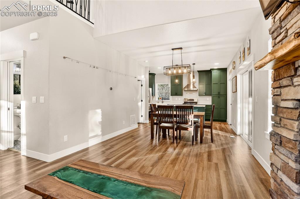 9920 Hodgen Road Colorado Springs, CO 80908 - Photo 9 of 49 a view of a dining room with furniture and wooden floor