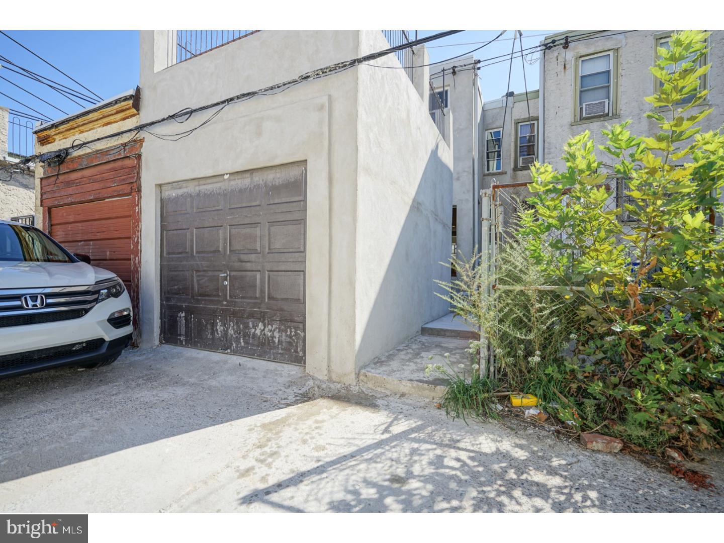 2118 South Lambert Street Philadelphia, PA 19145 - Photo 23 of 24 a view of a house with a garage