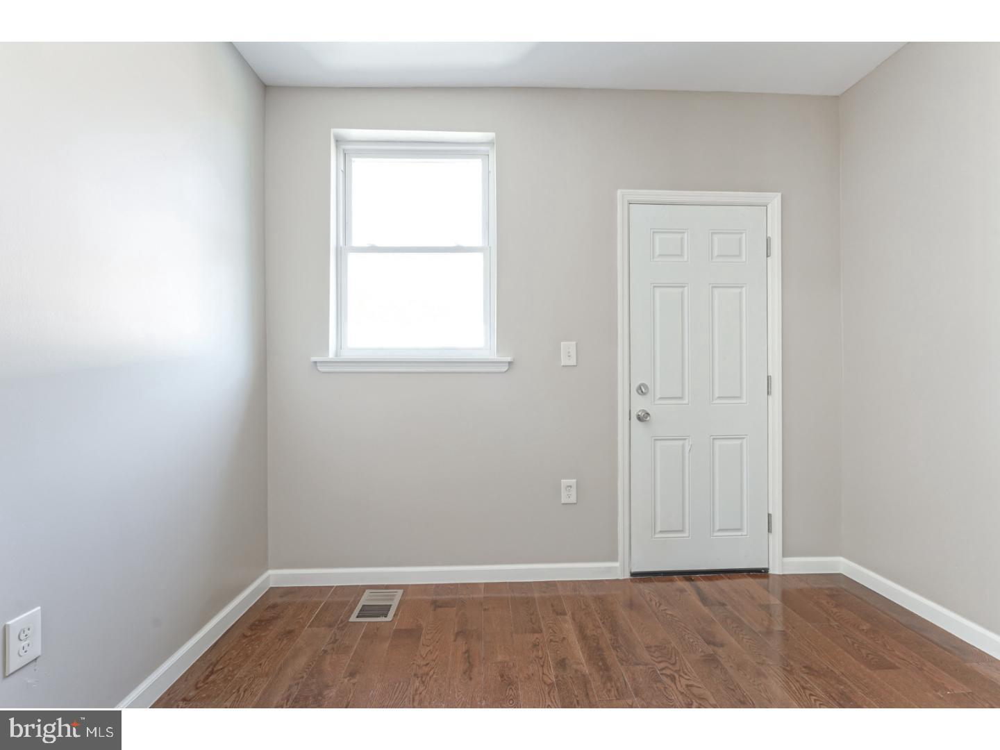 2118 South Lambert Street Philadelphia, PA 19145 - Photo 10 of 24 an empty room with a window