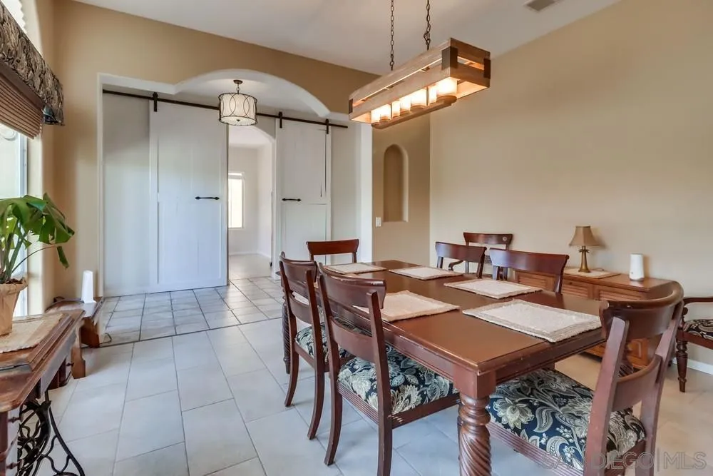 15735 Lawson Valley Road Jamul, CA 91935 - Photo 12 of 37 a view of a dining room with furniture and chandelier