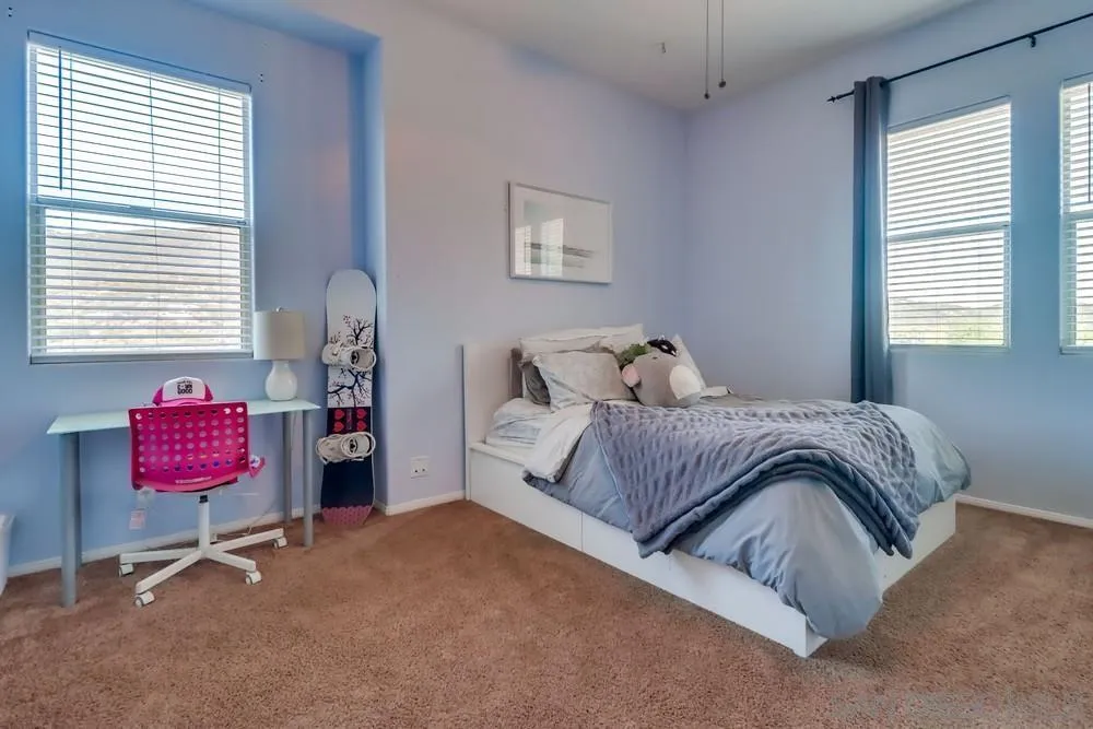 15735 Lawson Valley Road Jamul, CA 91935 - Photo 17 of 37 a bedroom with a bed and furniture