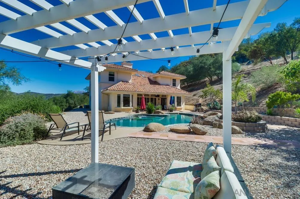 15735 Lawson Valley Road Jamul, CA 91935 - Photo 23 of 37 a view of an chairs and tables in the patio
