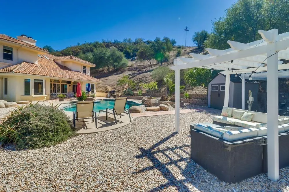 15735 Lawson Valley Road Jamul, CA 91935 - Photo 24 of 37 a view of a patio with table and chairs and potted plants