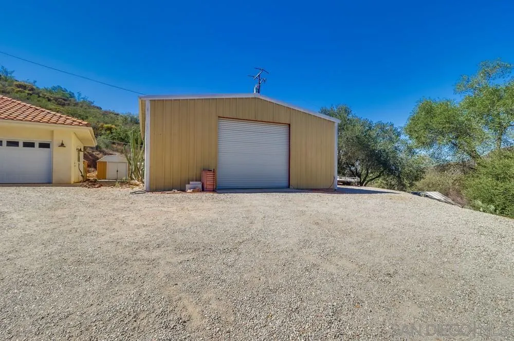 15735 Lawson Valley Road Jamul, CA 91935 - Photo 29 of 37 a view of a house with a yard