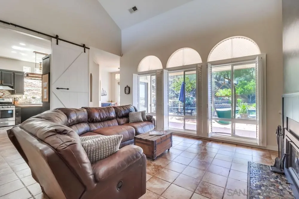 15735 Lawson Valley Road Jamul, CA 91935 - Photo 5 of 37 a living room with furniture and large windows