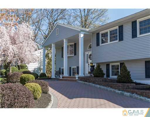 19 Moraine Road Edison, NJ 08820 - Photo 1 of 25 a front view of a house with a yard