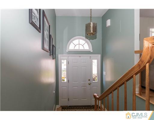 19 Moraine Road Edison, NJ 08820 - Photo 3 of 25 a view of a hallway with wooden floor and stairs