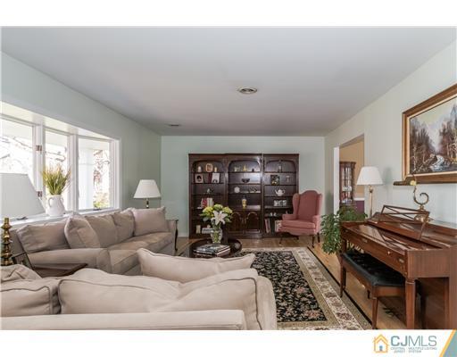19 Moraine Road Edison, NJ 08820 - Photo 4 of 25 a living room with furniture and a large window