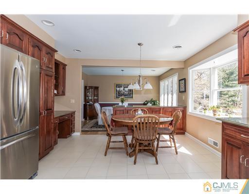 19 Moraine Road Edison, NJ 08820 - Photo 8 of 25 a view of a dining room with furniture window and wooden floor