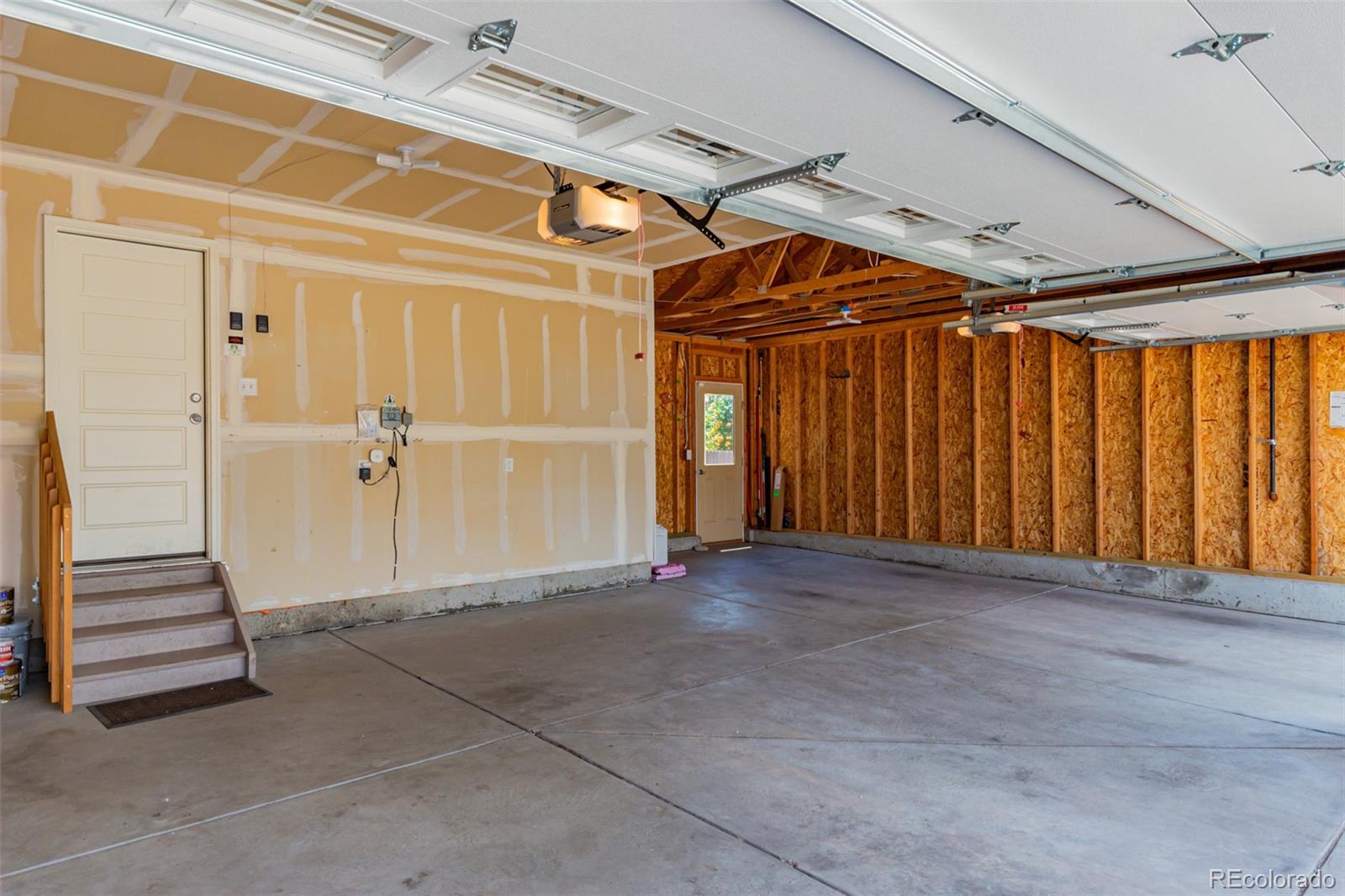 8546 Raspberry Drive Frederick, CO 80504 - Photo 41 of 44 a view of an empty room with stairs