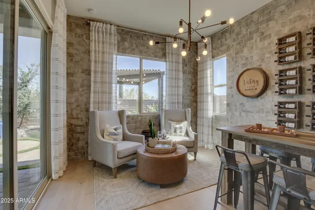 a view of a dining room with furniture and a large window