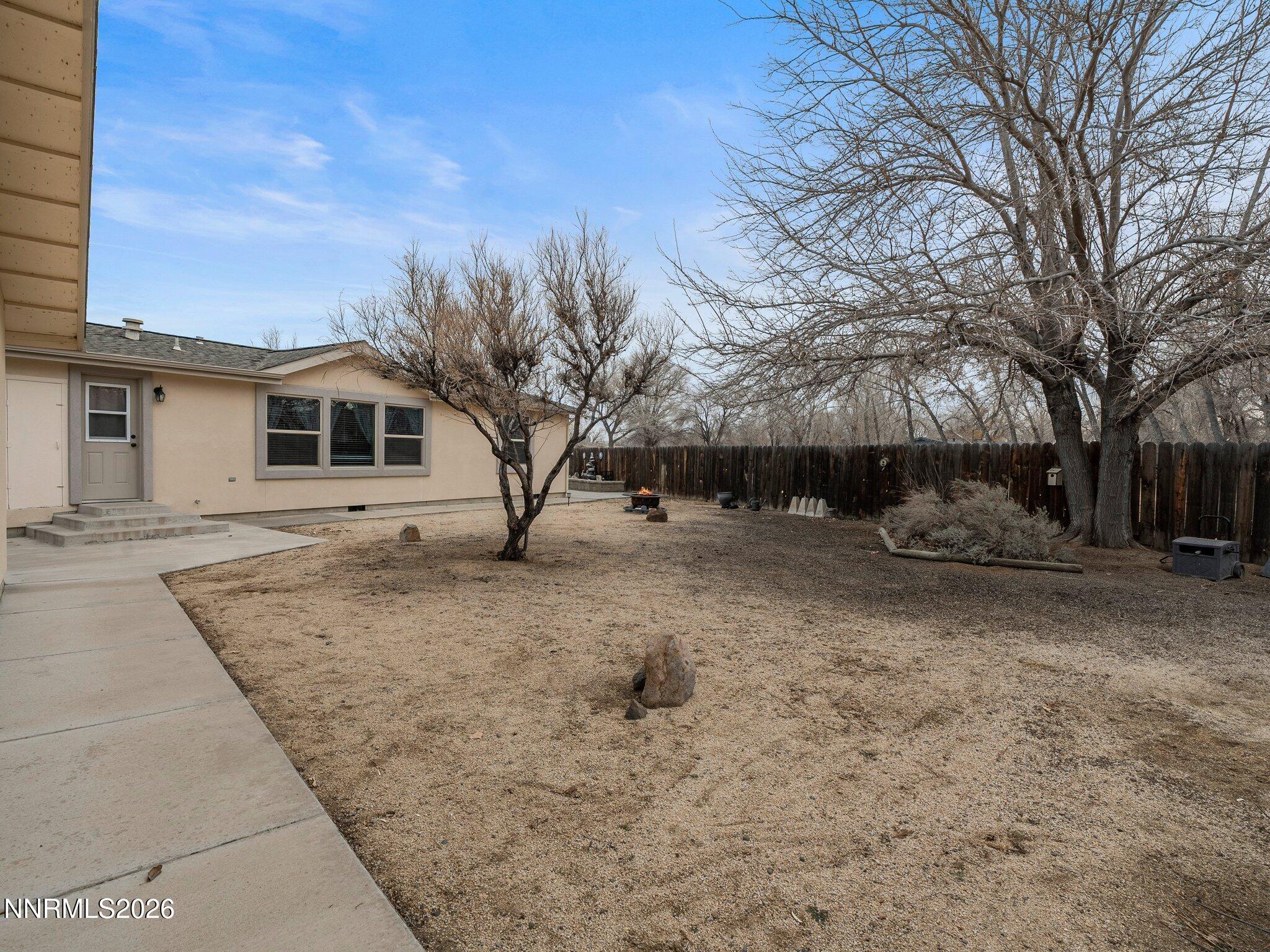 1125 Truckee Lane Fernley, NV 89408 - Photo 21 of 33 a view of a house with a yard