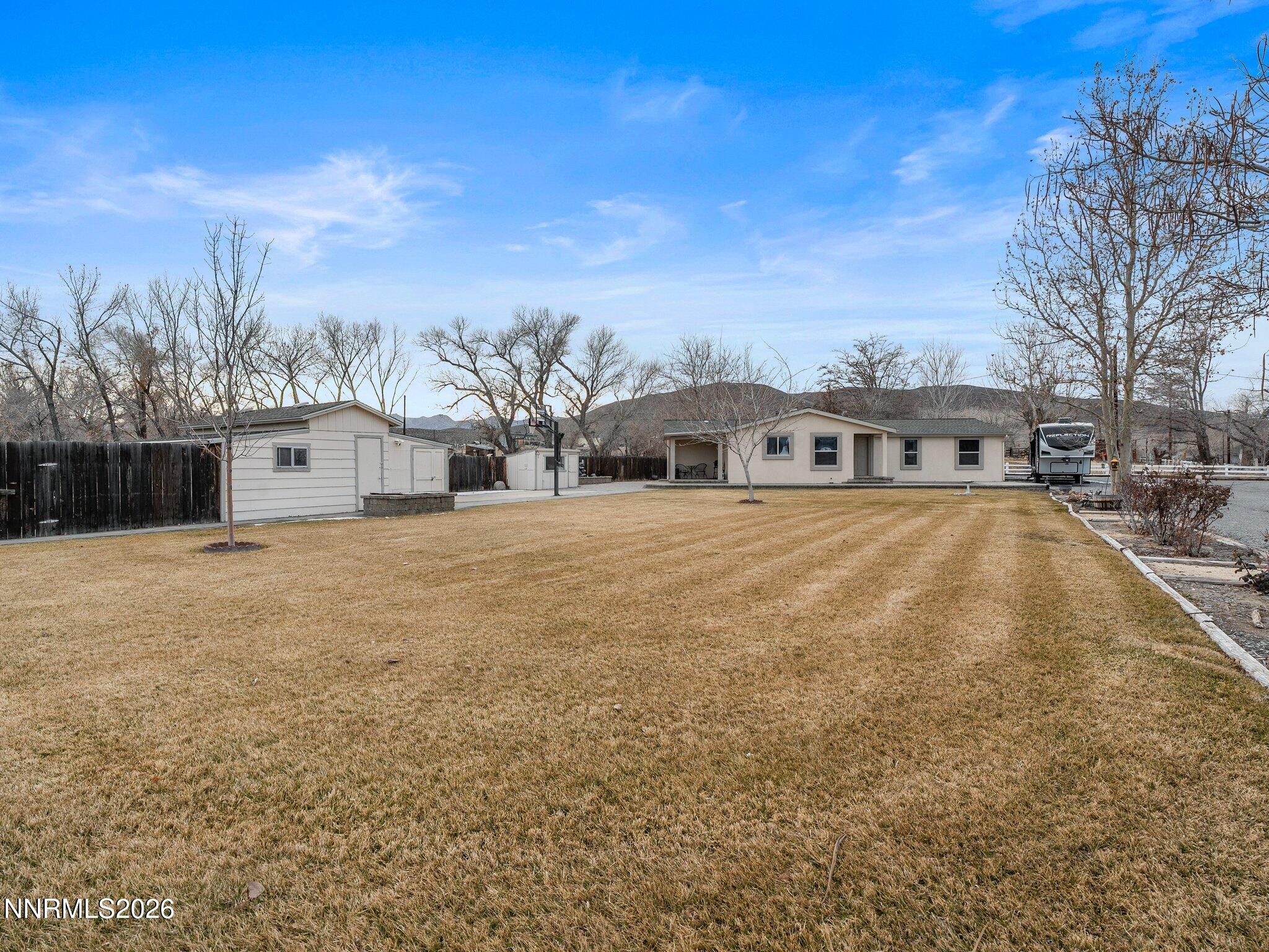 1125 Truckee Lane Fernley, NV 89408 - Photo 4 of 33 a view of a house with a yard