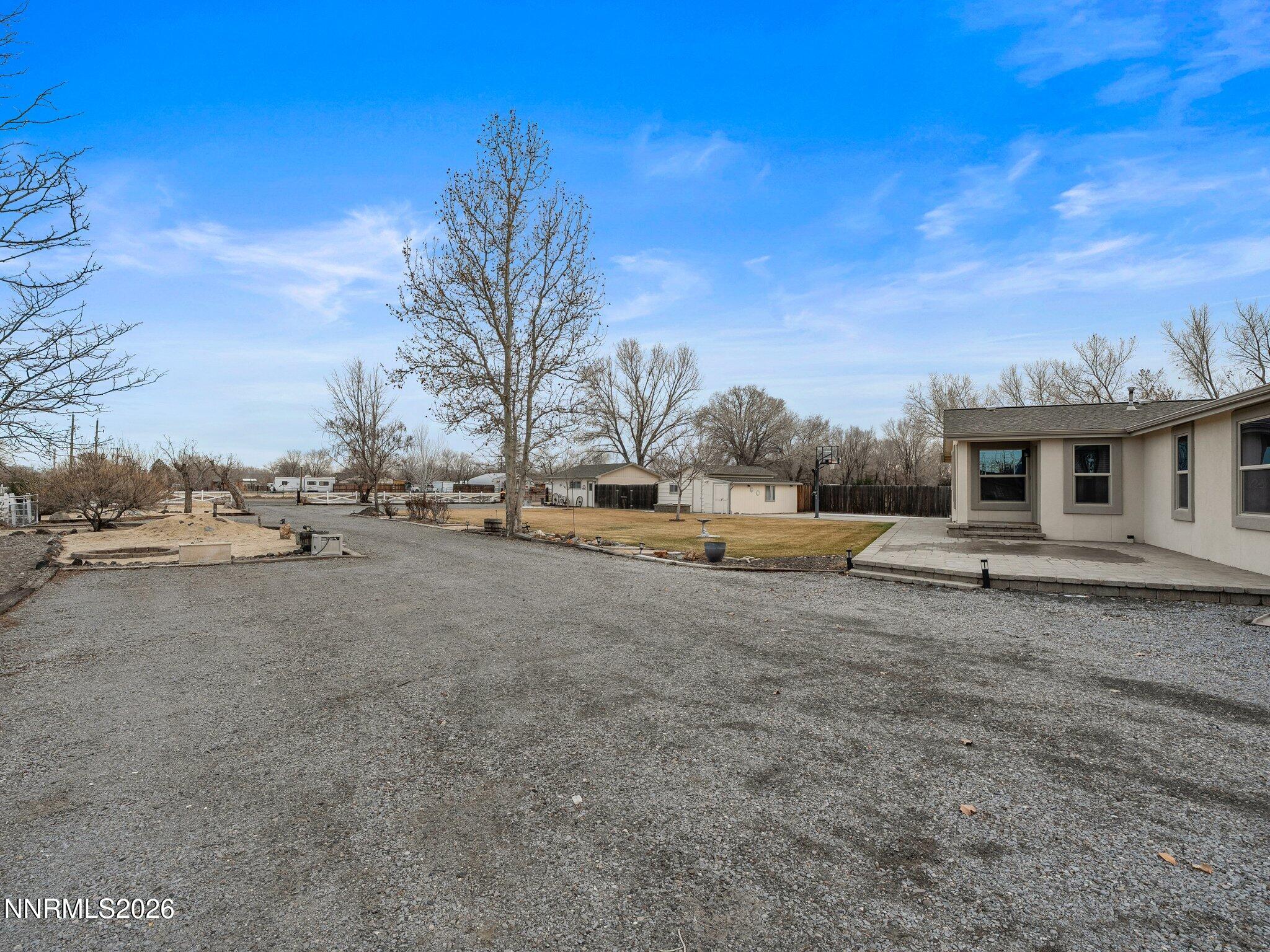 1125 Truckee Lane Fernley, NV 89408 - Photo 5 of 33 a backyard of a house with table and chairs