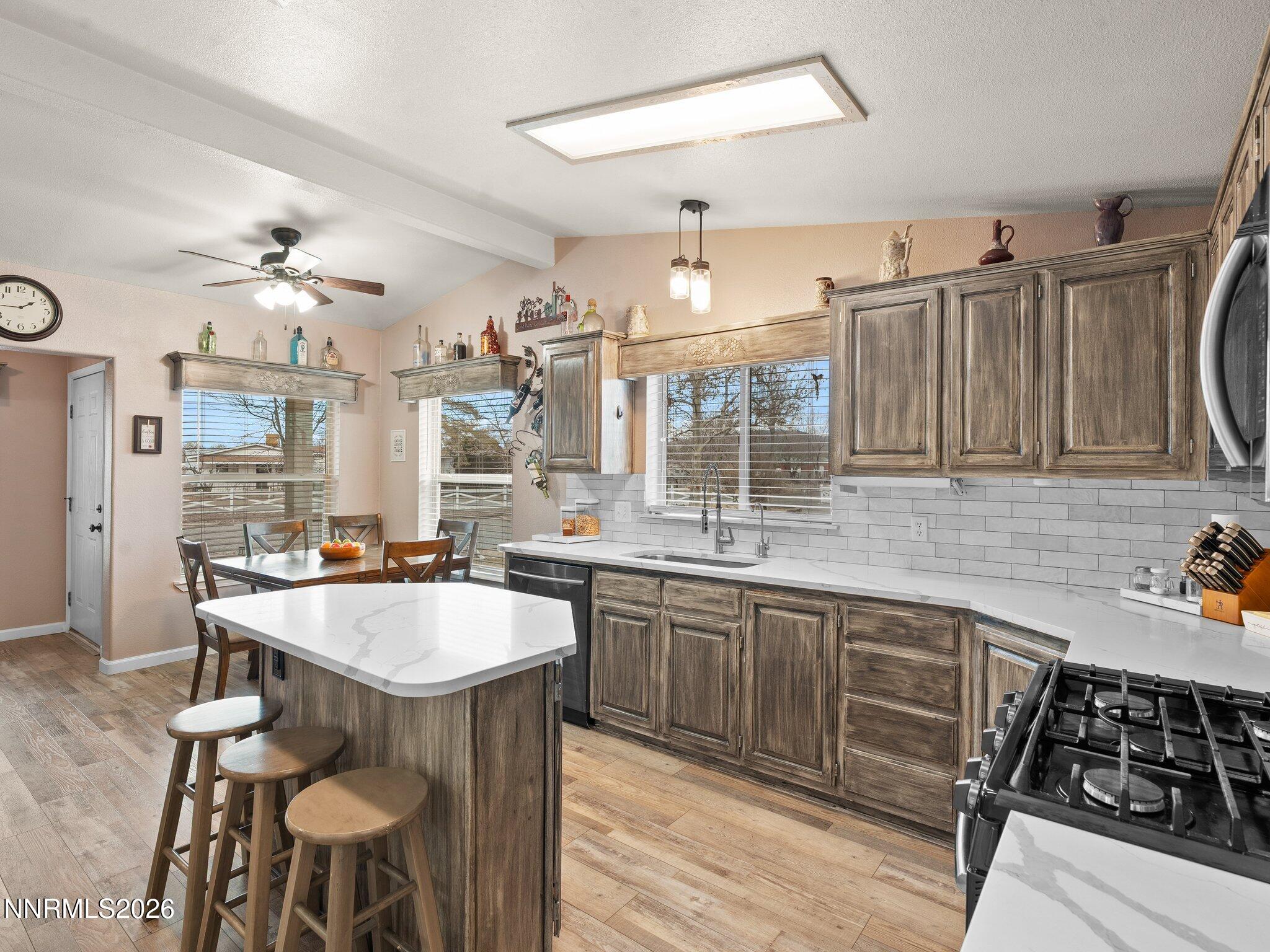1125 Truckee Lane Fernley, NV 89408 - Photo 7 of 33 a large kitchen with lots of counter space and appliances