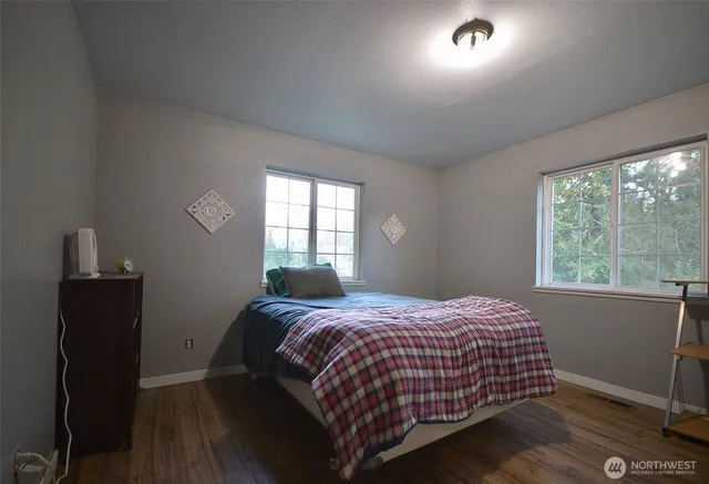 a bedroom with a bed and a closet