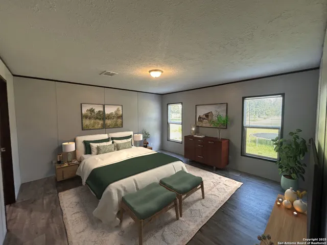 a bedroom with a bed window and a couch