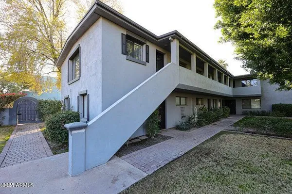 a front view of a house with yard