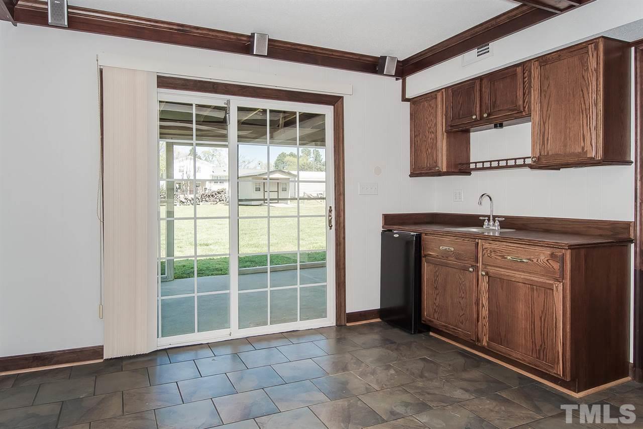 4213 Pin Oak Road Raleigh, NC 27604 - Photo 14 of 25 a kitchen with a sink and a cabinets