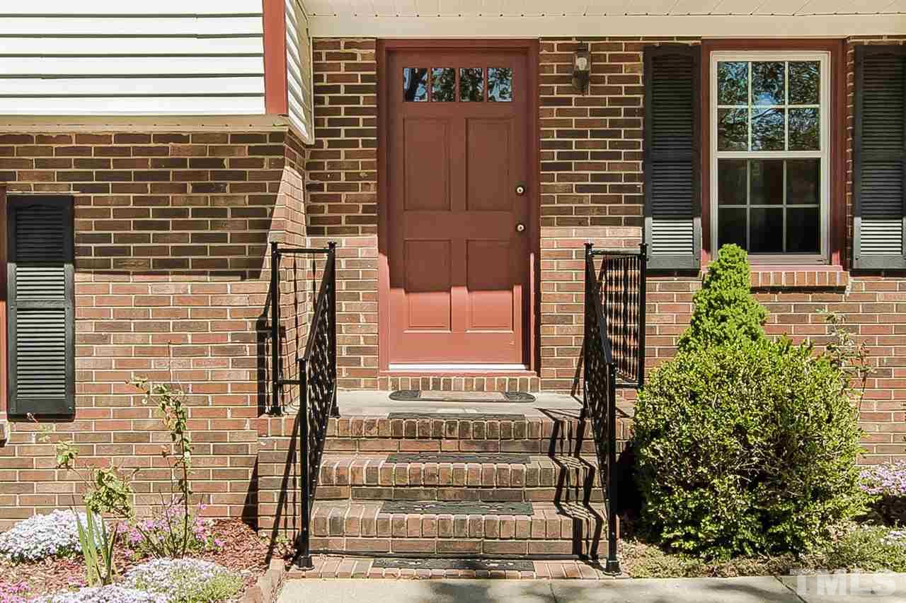 4213 Pin Oak Road Raleigh, NC 27604 - Photo 3 of 25 a front view of a building with a garden
