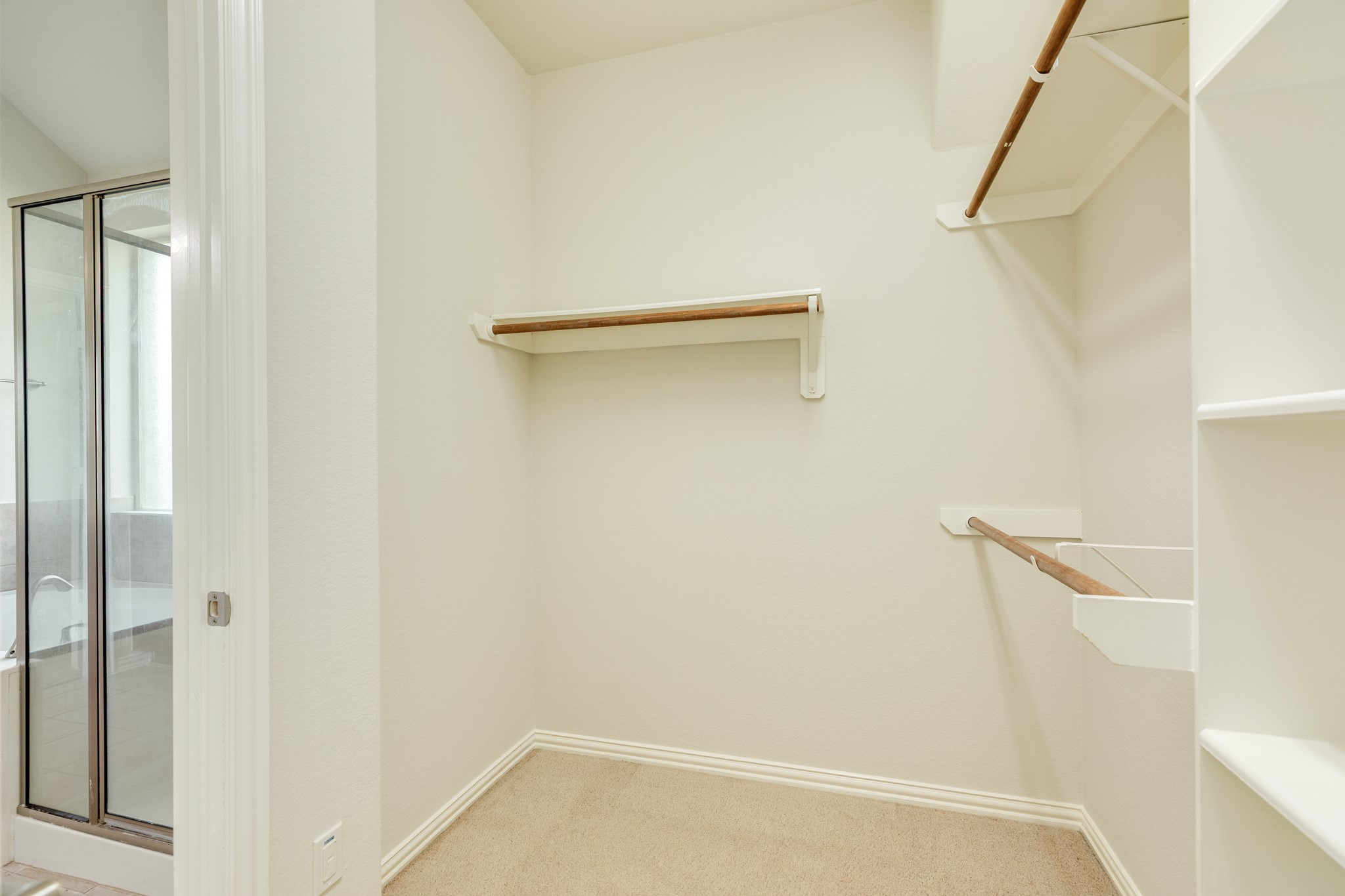 13417 Star Creek Lane Rosharon, TX 77583 - Photo 22 of 41 The walk-in closet has plenty of room with built-in shelving and clothes racks.