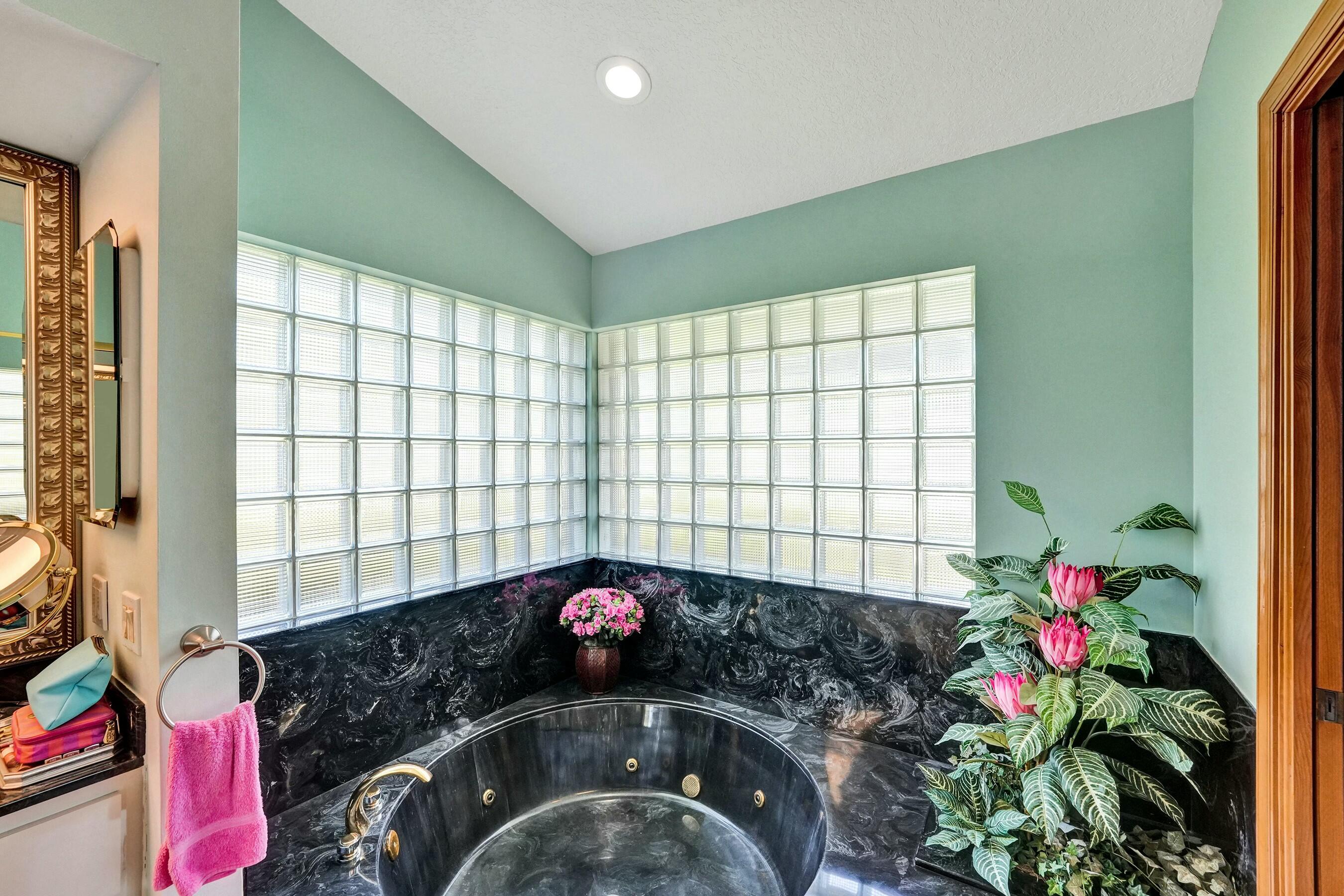 3120 Southeast Downwinds Road Jupiter, FL 33478 - Photo 15 of 33 a bedroom with a bed and a window