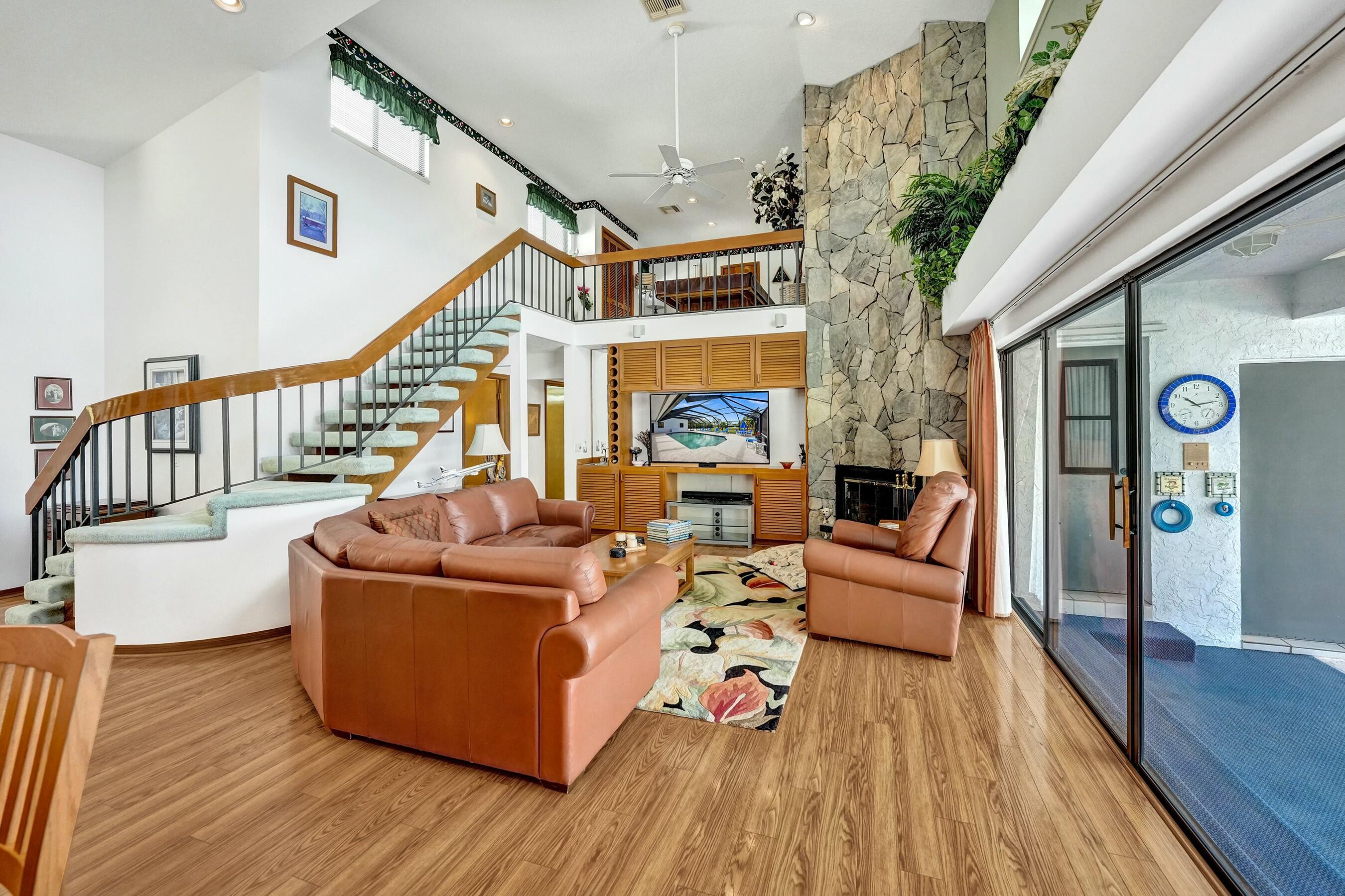 3120 Southeast Downwinds Road Jupiter, FL 33478 - Photo 17 of 33 a living room with furniture and wooden floor