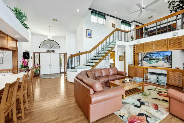 a living room with furniture or wooden floor and a large window