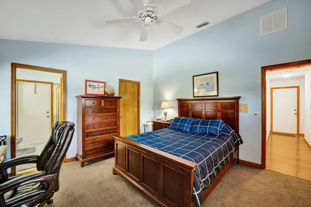 a room with furniture pool table and wooden floor