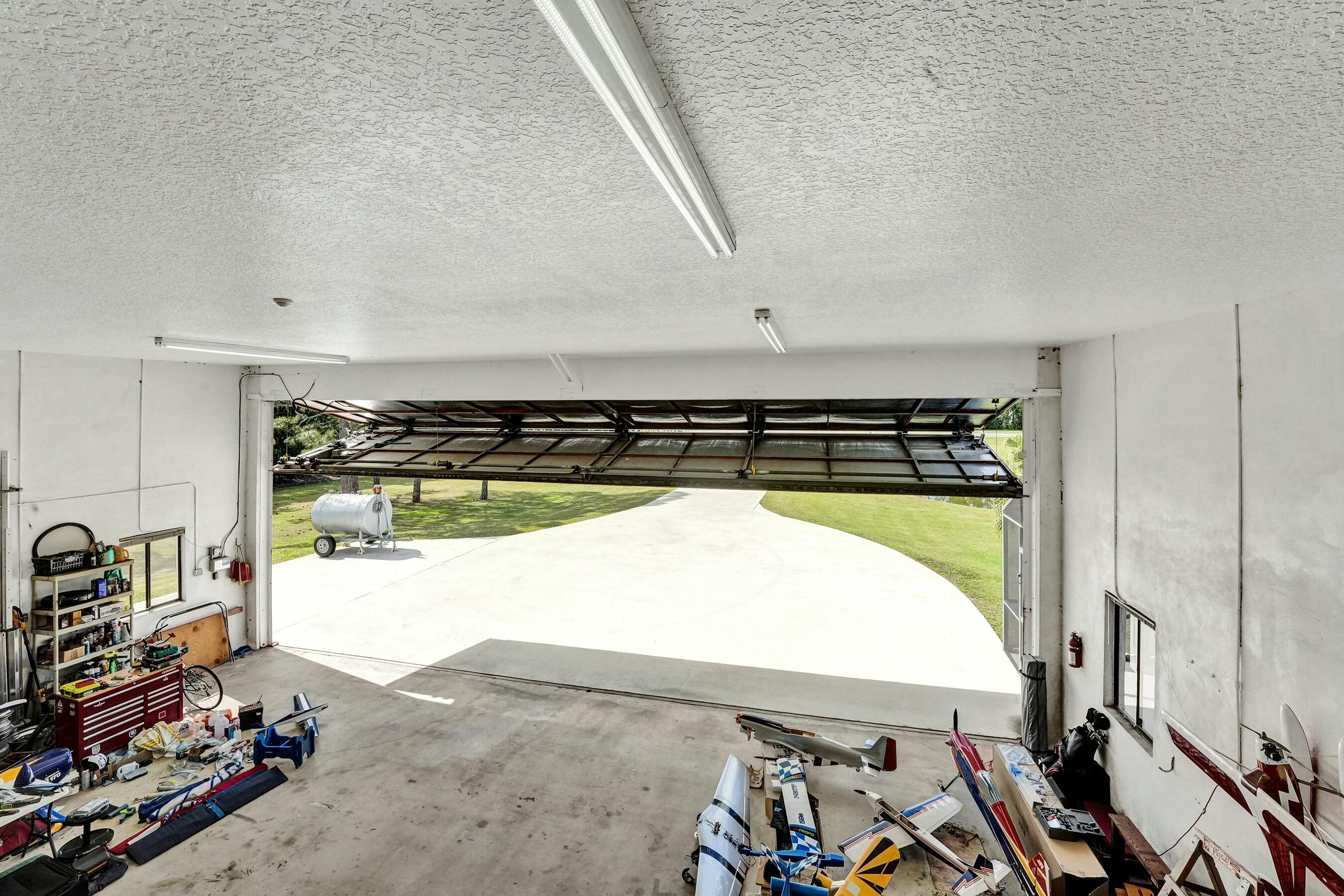3120 Southeast Downwinds Road Jupiter, FL 33478 - Photo 24 of 33 a view of walk in closet with clothes and shoes
